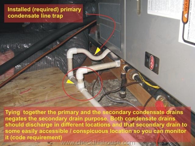 AC primary and the secondary condensate drains tied together which negates the secondary drain purpose - attic air conditioner drip pan installation