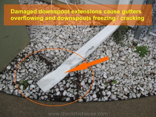 Damaged rain gutter downspout extension causes gutters overflowing and downspouts cracking