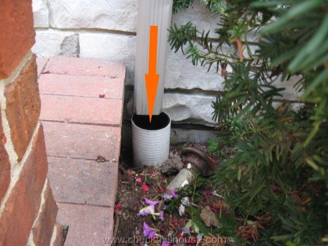 Extend rain gutter downspout into the underground drain pipe