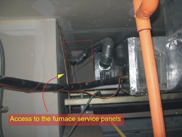Extremely limited access to the forced air furnace installed above the bathroom ceiling
