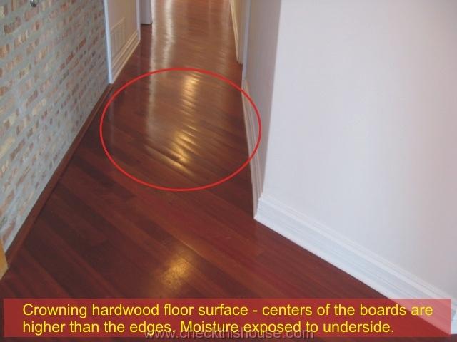 Chicago condo floor inspection - crowning hardwood floor surface 1