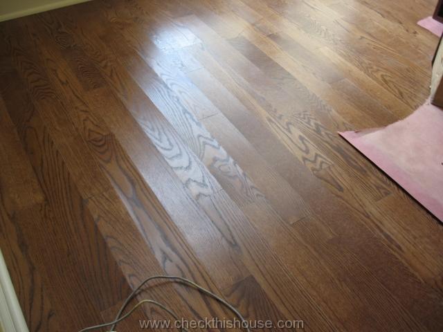 Chicago condo floor inspection - cupped hardwood floor surface.