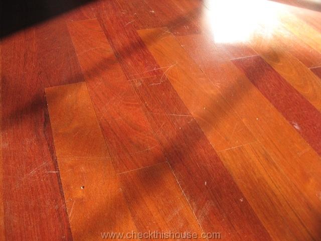 Chicago condo inspection - floor surface scratches might require sending buffing and application of additional coat of varnish