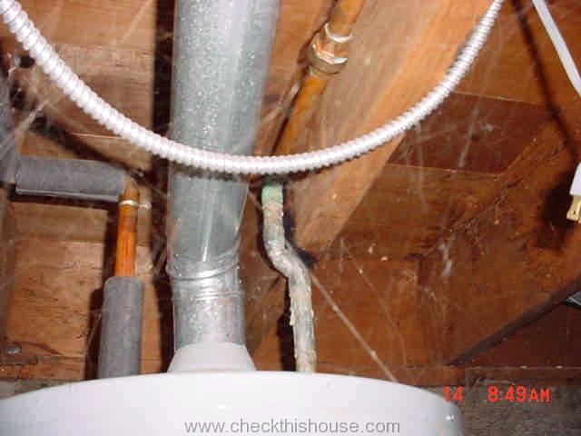 Gas water heater vent pipe located to close to combustible materials
