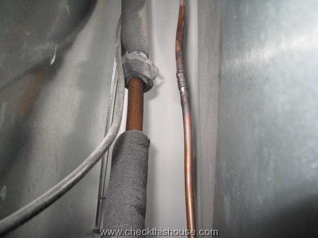 Refrigerant line insulation missing on AC suction line at the evaporator coil