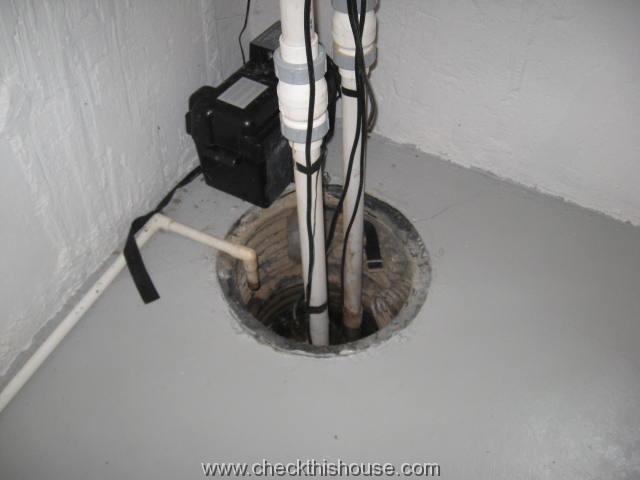 Missing cover on a house sump pump well poses safety hazard