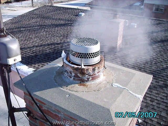 Pre-manufactured chimney crown - cracked, no expansion gap provided around the chimney flue