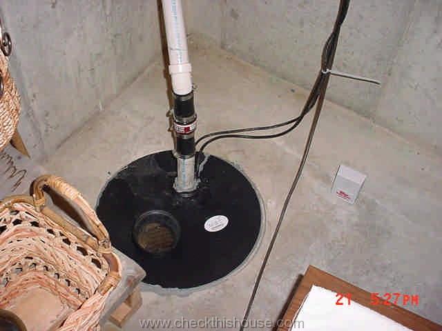 Typical house sump pump installation in the basement